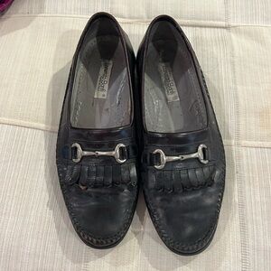 Lorenzo Banfi black leather loafers with a silver buckle